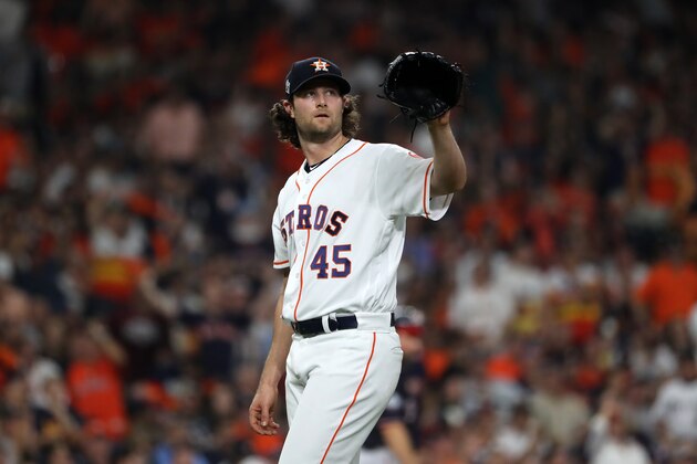 HOUSTON, TEXAS - OCTOBER 22:  Gerrit Cole #45 of the Houston Astros reacts after allowing a run against the Washington Nationals during the fifth inning in Game One of the 2019 World Series at Minute Maid Park on October 22, 2019 in Houston, Texas. (Photo by Elsa/Getty Images)