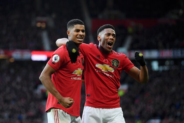 MANCHESTER, ENGLAND - NOVEMBER 10: Marcus Rashford of Manchester United celebrates with teammate Anthony Martial after scoring his team's third goal during the Premier League match between Manchester United and Brighton & Hove Albion at Old Trafford on November 10, 2019 in Manchester, United Kingdom. (Photo by Michael Regan/Getty Images)