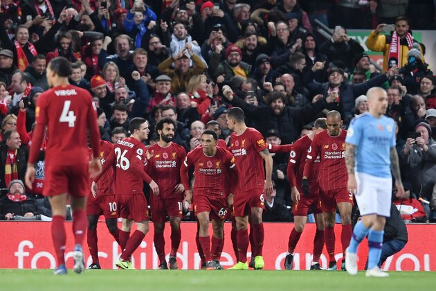 LIVERPOOL, ENGLAND - NOVEMBER 10: Mohamed Salah of Liverpool celebrates with teammates after scoring his team's second goal during the Premier League match between Liverpool FC and Manchester City at Anfield on November 10, 2019 in Liverpool, United Kingdom. (Photo by Laurence Griffiths/Getty Images)