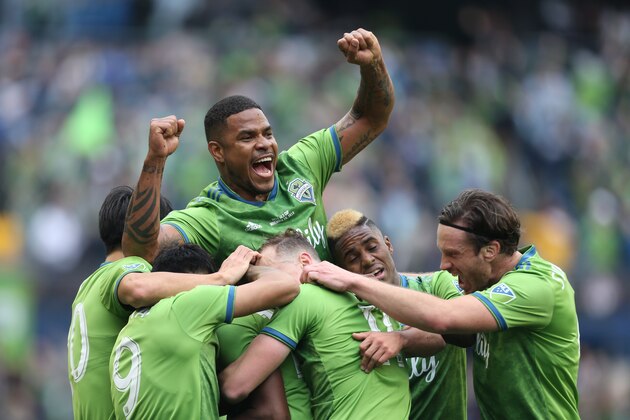 SEATTLE, WA - NOVEMBER 10: Roman Torres #29 of Seattle Sounders FC celebrates the 1st goal with his teammates during the match between Toronto FC and Seattle Sounders as part of the MLS Cup 2019 at CenturyLink Field on November 10, 2019 in Seattle, Washington. (Photo by Omar Vega/Getty Images)