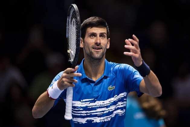 LONDON, ENGLAND - NOVEMBER 10: Novak Djokovic of Serbia celebrates after his 6-2 6-1 victory against Matteo Berrettini of Italy during Day one of the Nitto ATP World Tour Finals at The O2 Arena on November 10, 2019 in London, England. (Photo by TPN/Getty Images) LONDON, ENGLAND - NOVEMBER 10: Novak Djokovic of Serbia celebrates after his 6-2 6-1 victory against Matteo Berrettini of Italy during Day one of the Nitto ATP World Tour Finals at The O2 Arena on November 10, 2019 in London, England. (Photo by TPN/Getty Images)