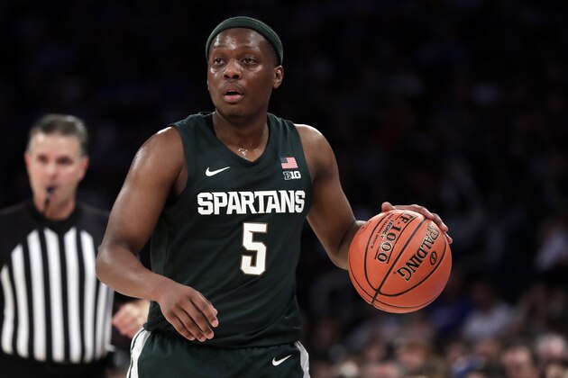 Michigan State guard Cassius Winston (5) dribbles the ball during the first half of an NCAA college basketball game against Kentucky on Tuesday, Nov. 5, 2019, in New York. (AP Photo/Adam Hunger)