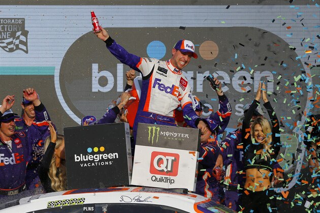 AVONDALE, ARIZONA - NOVEMBER 10: Denny Hamlin, driver of the #11 FedEx Ground Toyota, celebrates in Victory Lane after winning the Monster Energy NASCAR Cup Series Bluegreen Vacations 500 at ISM Raceway on November 10, 2019 in Avondale, Arizona. (Photo by Jonathan Ferrey/Getty Images)