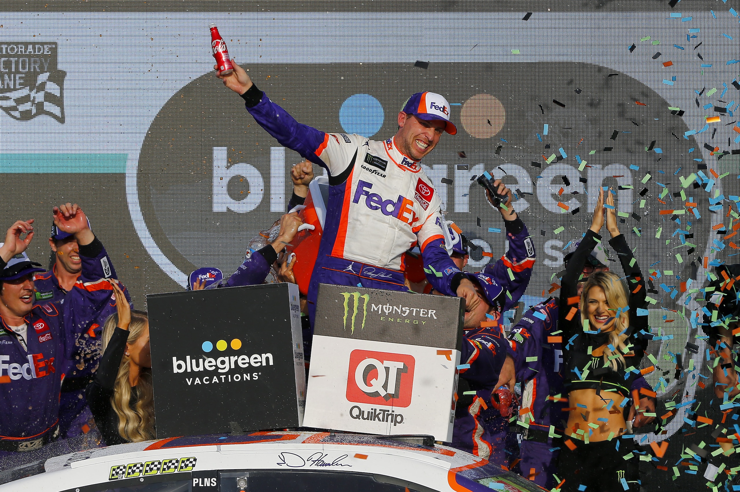 AVONDALE, ARIZONA - NOVEMBER 10: Denny Hamlin, driver of the #11 FedEx Ground Toyota, celebrates in Victory Lane after winning the Monster Energy NASCAR Cup Series Bluegreen Vacations 500 at ISM Raceway on November 10, 2019 in Avondale, Arizona. (Photo by Jonathan Ferrey/Getty Images)