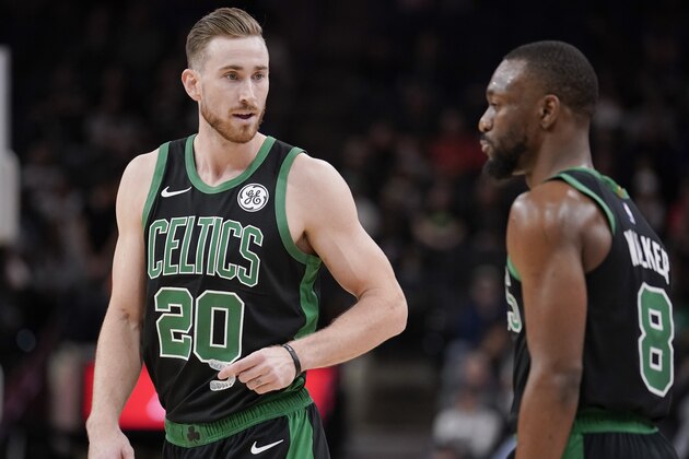 Boston Celtics' Gordon Hayward (20) talks to teammate Kemba Walker during the first half of an NBA basketball game against the San Antonio Spurs, Saturday, Nov. 9, 2019, in San Antonio. Boston won 135-115. (AP Photo/Darren Abate)