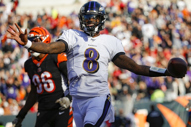 Baltimore Ravens quarterback Lamar Jackson (8) celebrates his touchdown during the second half of NFL football game against the Cincinnati Bengals, Sunday, Nov. 10, 2019, in Cincinnati. (AP Photo/Frank Victores)
