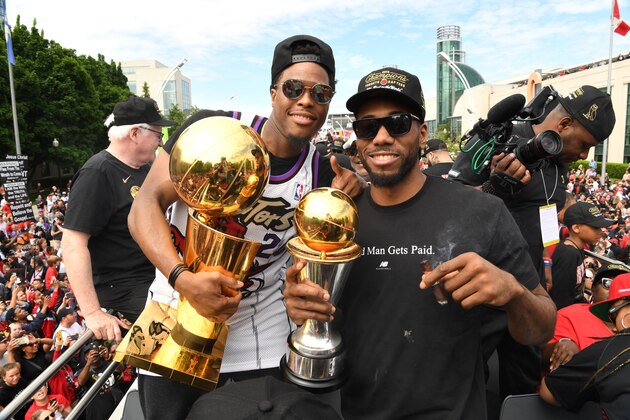 TORONTO, ON - JUNE 17: Kyle Lowry #7 and Kawhi Leonard #2 of the Toronto Raptors are photographed with the Championship Trophies on the team bus during the Toronto Raptors Championship Victory Parade on June 17, 2019 in Toronto, Ontario. NOTE TO USER: User expressly acknowledges and agrees that, by downloading and/or using this photograph, user is consenting to the terms and conditions of Getty Images License Agreement. Mandatory Copyright Notice: Copyright 2019 NBAE (Photo by Ron Turenne/NBAE via Getty Images)