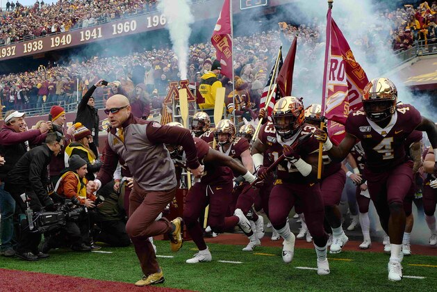 MINNEAPOLIS, MN - NOVEMBER 09: Head coach P.J. Fleck of the Minnesota Golden Gophers and his team take the field against the Penn State Nittany Lions at TCFBank Stadium on November 9, 2019 in Minneapolis, Minnesota. (Photo by Adam Bettcher/Getty Images)