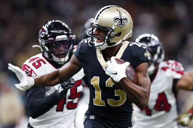 New Orleans Saints wide receiver Michael Thomas (13) carries on a pass reception ahead of Atlanta Falcons linebacker Deion Jones (45) and defensive end Vic Beasley (44) in the first half of an NFL football game in New Orleans, Sunday, Nov. 10, 2019. (AP Photo/Rusty Costanza)