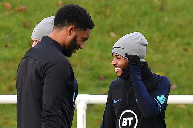 England's defender Joe Gomez (L) and England's midfielder Raheem Sterling attend an England team training session at St George's Park in Burton-on-Trent, central England on November 12, 2019, ahead of their Euro 2020 football qualification match against Montenegro. (Photo by Paul ELLIS / AFP) / NOT FOR MARKETING OR ADVERTISING USE / RESTRICTED TO EDITORIAL USE (Photo by PAUL ELLIS/AFP via Getty Images)