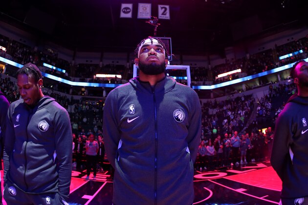 MINNEAPOLIS, MN -  NOVEMBER 10: Karl-Anthony Towns #32 of the Minnesota Timberwolves stands for the National Anthem before the game against the Denver Nuggets on November 10, 2019 at Target Center in Minneapolis, Minnesota. NOTE TO USER: User expressly acknowledges and agrees that, by downloading and or using this Photograph, user is consenting to the terms and conditions of the Getty Images License Agreement. Mandatory Copyright Notice: Copyright 2019 NBAE (Photo by David Sherman/NBAE via Getty Images)