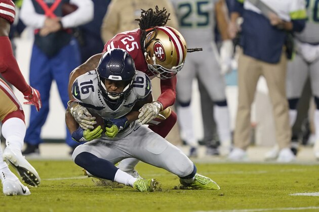 San Francisco 49ers cornerback Richard Sherman (25) tackles Seattle Seahawks wide receiver Tyler Lockett (16) during the first half of an NFL football game in Santa Clara, Calif., Monday, Nov. 11, 2019. (AP Photo/Tony Avelar)