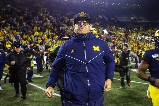 Michigan head coach Jim Harbaugh walks off the field at the end of an NCAA college football game against Notre Dame in Ann Arbor, Mich., Saturday, Oct. 26, 2019. Michigan won 45-14. (AP Photo/Tony Ding)
