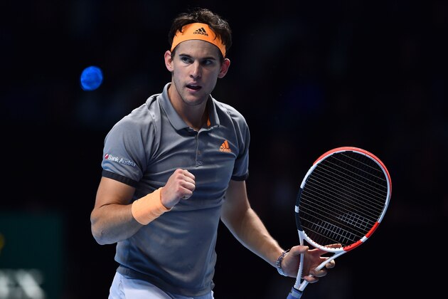 Austria's Dominic Thiem reacts against Serbia's Novak Djokovic during their men's singles round-robin match on day three of the ATP World Tour Finals tennis tournament at the O2 Arena in London on November 12, 2019. (Photo by Glyn KIRK / AFP) (Photo by GLYN KIRK/AFP via Getty Images)