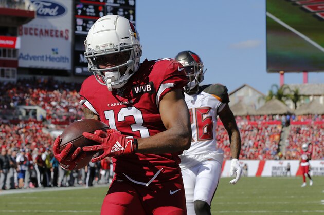 Arizona Cardinals wide receiver Christian Kirk (13) pulls in a 33-yard touchdown pass in front of Tampa Bay Buccaneers cornerback M.J. Stewart (36) during the first half of an NFL football game Sunday, Nov. 10, 2019, in Tampa, Fla. (AP Photo/Mark LoMoglio)