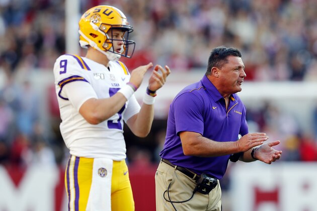 TUSCALOOSA, ALABAMA - NOVEMBER 09: Joe Burrow #9 of the LSU Tigers and head coach Ed Orgeron react during the first half against the Alabama Crimson Tide in the game at Bryant-Denny Stadium on November 09, 2019 in Tuscaloosa, Alabama. (Photo by Kevin C. Cox/Getty Images)
