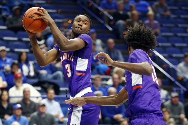 Evansville's Jawaun Newton (3) pulls down a rebound near teammate DeAndre Williams during the first half of an NCAA college basketball game against Kentucky in Lexington, Ky., Tuesday, Nov. 12, 2019. (AP Photo/James Crisp)