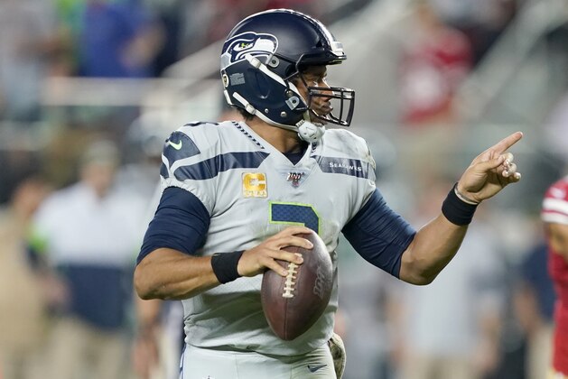 SANTA CLARA, CALIFORNIA - NOVEMBER 11: Russell Wilson #3 of the Seattle Seahawks rolls out looking to pass against  the San Francisco 49ers during the third quarter in the game at Levi's Stadium on November 11, 2019 in Santa Clara, California. (Photo by Thearon W. Henderson/Getty Images)