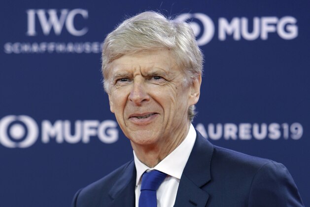 FILE - In this Monday, Feb. 18, 2019 file photo, former Arsenal soccer team manager Arsene Wenger arrives for the 2019 Laureus World Sports Awards. FIFA says it hired Arsene Wenger in a full-time role leading its global work developing soccer. Wenger accepted FIFA’s offer more than two months after it was reported, and one week after talks with Bayern Munich about the German champion’s vacant head coach job. He will oversee the rules-making panel known as IFAB, coaching programs and technical analysis of games at FIFA tournaments.  (AP Photo/Claude Paris, File)