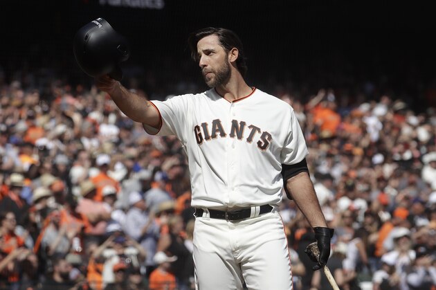 San Francisco Giants' Madison Bumgarner gestures toward fans before pinch hitting against the Los Angeles Dodgers during the fifth inning of a baseball game in San Francisco, Sunday, Sept. 29, 2019. (AP Photo/Jeff Chiu)