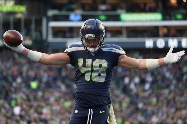 SEATTLE, WASHINGTON - NOVEMBER 03: Jacob Hollister #48 of the Seattle Seahawks celebrates after scoring the game winning touchdown in overtime against the Tampa Bay Buccaneers during their game at CenturyLink Field on November 03, 2019 in Seattle, Washington. (Photo by Abbie Parr/Getty Images)