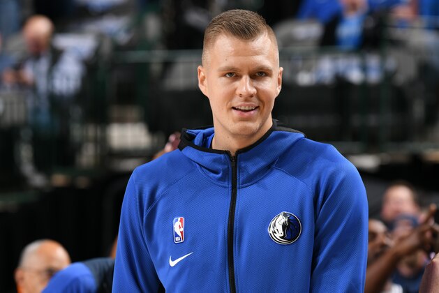 DALLAS, TX - OCTOBER 11: Kristaps Porzingis #6 of the Dallas Mavericks smiles before game against the Orlando Magic on October 11, 2019 at the American Airlines Center in Dallas, Texas. NOTE TO USER: User expressly acknowledges and agrees that, by downloading and or using this photograph, User is consenting to the terms and conditions of the Getty Images License Agreement. Mandatory Copyright Notice: Copyright 2019 NBAE (Photo by Glenn James/NBAE via Getty Images)