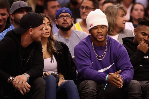 PHOENIX, ARIZONA - NOVEMBER 12:  Kyler Murray (R) of the Arizona Cardinals talks with Cody Bellinger of the Los Angeles Dodgers during the first half of the NBA game between the Phoenix Suns and the Los Angeles Lakers at Talking Stick Resort Arena on November 12, 2019 in Phoenix, Arizona.  The Lakers defeated the Suns 123-115.  NOTE TO USER: User expressly acknowledges and agrees that, by downloading and/or using this photograph, user is consenting to the terms and conditions of the Getty Images License Agreement  (Photo by Christian Petersen/Getty Images)