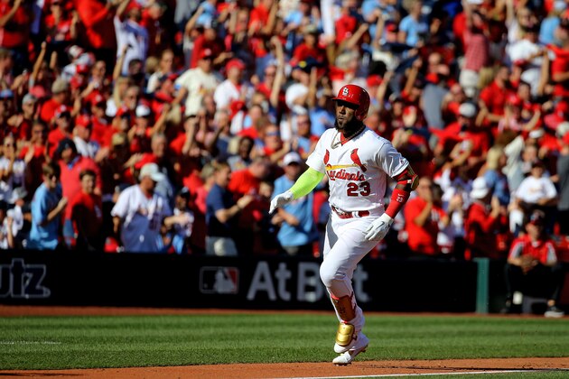 ST LOUIS, MISSOURI - OCTOBER 07:  Marcell Ozuna #23 of the St. Louis Cardinals celebrates as he rounds third base, after hitting his second solo home run of the game, against the Atlanta Braves during the fourth inning in game four of the National League Division Series at Busch Stadium on October 07, 2019 in St Louis, Missouri. (Photo by Scott Kane/Getty Images)