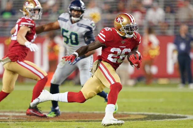 SANTA CLARA, CALIFORNIA - NOVEMBER 11: Tevin Coleman #26 of the San Francisco 49ers carries the ball against the Seattle Seahawks during the first quarter of an NFL football game at Levi's Stadium on November 11, 2019 in Santa Clara, California. (Photo by Thearon W. Henderson/Getty Images)