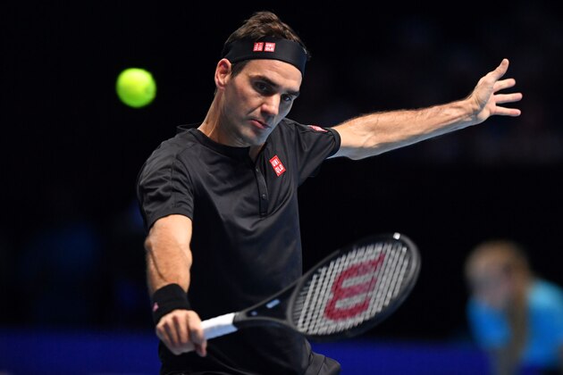 Switzerland's Roger Federer returns against Serbia's Novak Djokovic during their men's singles round-robin match on day five of the ATP World Tour Finals tennis tournament at the O2 Arena in London on November 14, 2019. (Photo by Ben STANSALL / AFP) (Photo by BEN STANSALL/AFP via Getty Images)