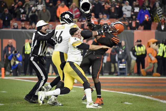 CLEVELAND, OHIO - NOVEMBER 14: Quarterback Mason Rudolph #2 of the Pittsburgh Steelers fights with defensive end Myles Garrett #95 of the Cleveland Browns during the second half at FirstEnergy Stadium on November 14, 2019 in Cleveland, Ohio. The Browns defeated the Steelers 21-7.  (Photo by Jason Miller/Getty Images)