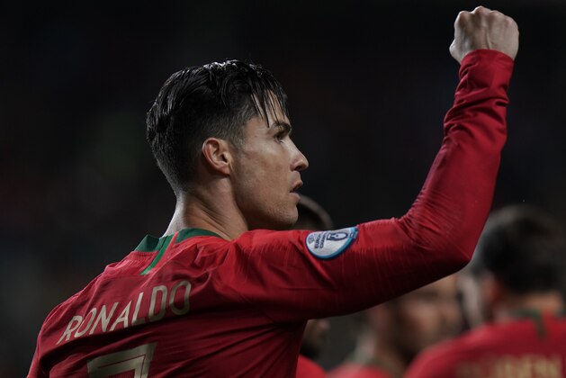 FARO, PORTUGAL - NOVEMBER 14:   Cristiano Ronaldo of Portugal and Juventus celebrates after scoring a goal during the UEFA Euro 2020 Qualifier match between Portugal and Lithuania at Estadio Algarve on November 14, 2019 in Faro, Portugal.  (Photo by Gualter Fatia/Getty Images)