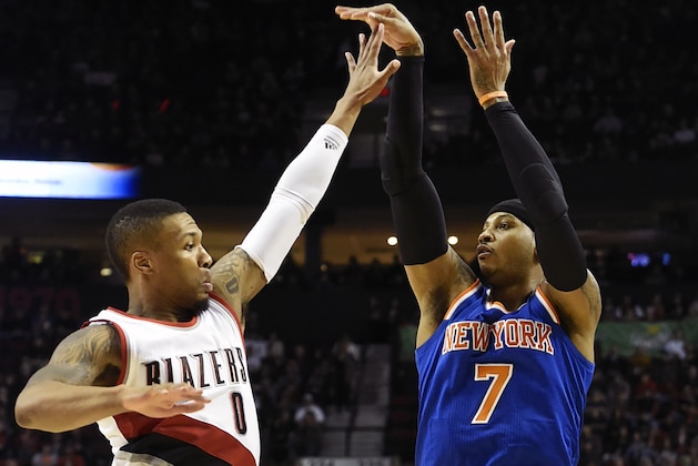 New York Knicks forward Carmelo Anthony (7) shoots over Portland Trail Blazers guard Damian Lillard (0) during the first half of an NBA basketball game in Portland, Ore., Saturday, Dec. 12, 2015. (AP Photo/Steve Dykes)