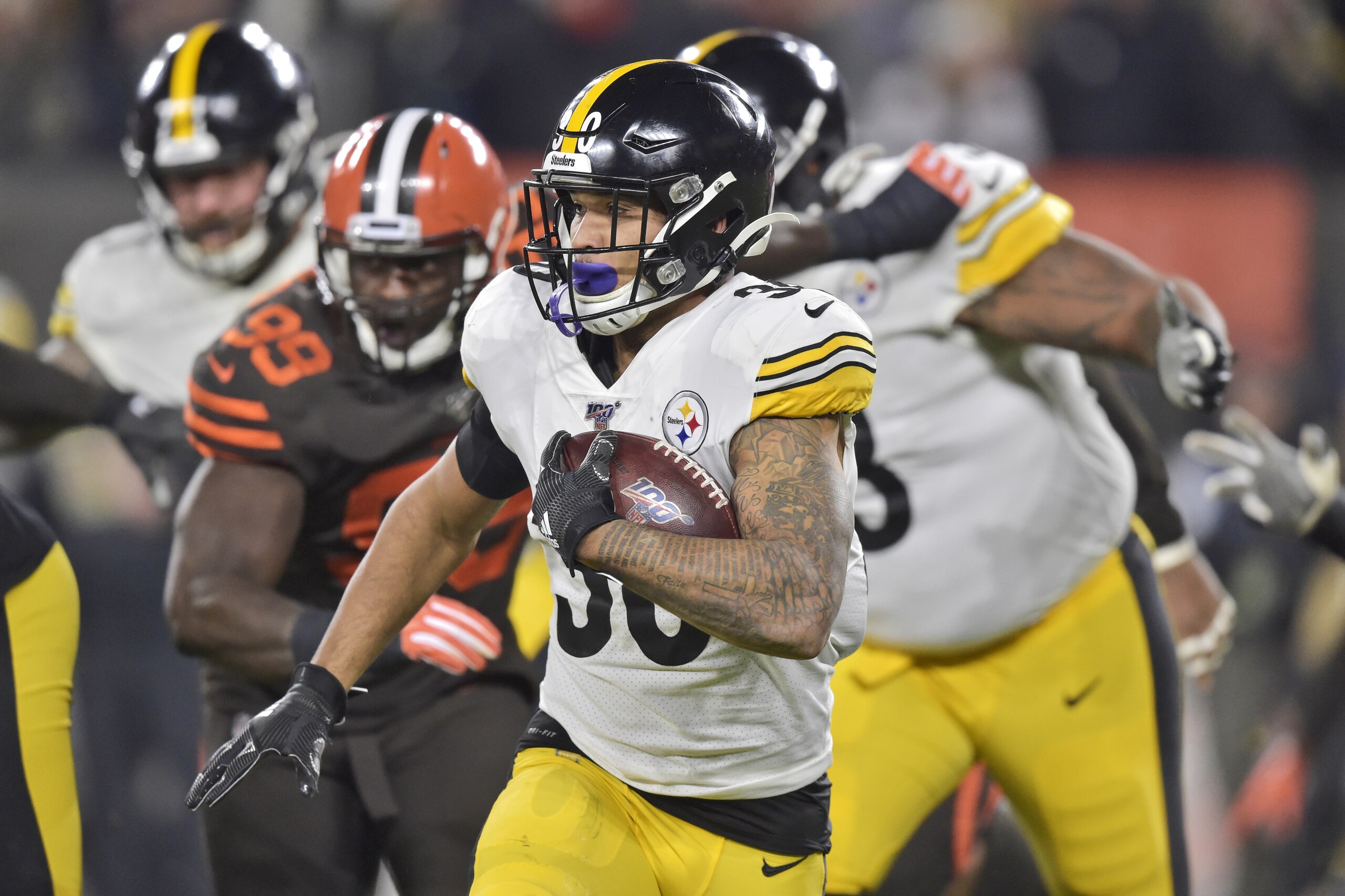 Pittsburgh Steelers running back James Conner (30) rushes against the Cleveland Browns during the first half of an NFL football game Thursday, Nov. 14, 2019, in Cleveland. (AP Photo/David Richard)