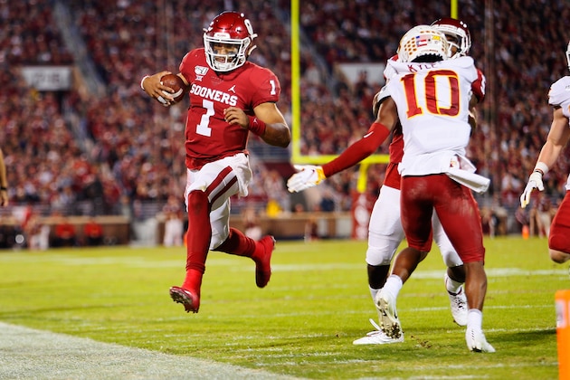 NORMAN, OK - NOVEMBER 9:  Quarterback Jalen Hurts #1 of the Oklahoma Sooners heads out of bounds just shy of the end zone against defensive back Tayvonn Kyle #10 of the Iowa State Cyclones late in the second quarter on November 9, 2019 at Gaylord Family Oklahoma Memorial Stadium in Norman, Oklahoma. The Sooners won 42-41.  (Photo by Brian Bahr/Getty Images)