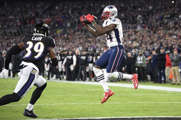 New England Patriots wide receiver Mohamed Sanu (14) makes a touchdown catch on a pass from quarterback Tom Brady, not visible, as Baltimore Ravens safety Jordan Richards (39) defends during the first half of an NFL football game, Sunday, Nov. 3, 2019, in Baltimore. (AP Photo/Nick Wass)
