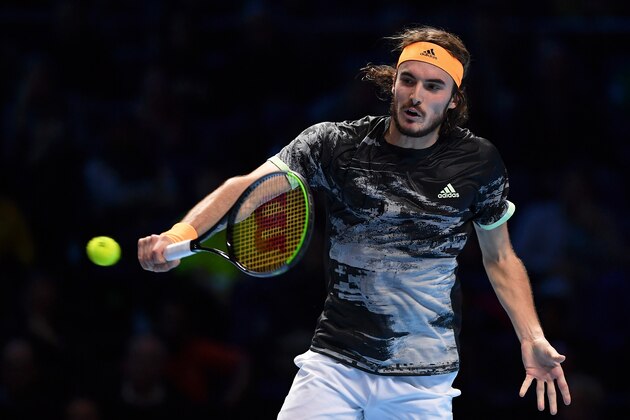 LONDON, ENGLAND - NOVEMBER 16: Stefanos Tsitsipas of Greece plays a backhand in his semi-final singles match against Roger Federer of Switzerland during Day Seven of the Nitto ATP World Tour Finals at The O2 Arena on November 16, 2019 in London, England. (Photo by Justin Setterfield/Getty Images)