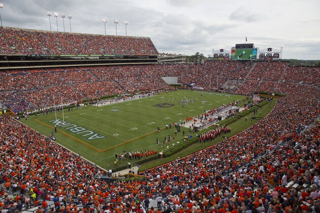 FILE - In this Sept. 27, 2014, file photo, fans watch an NCAA college football game between Auburn and Louisiana Tech at Jordan-Hare Stadium in Auburn, Ala. Auburn will have a new scoreboard at Jordan-Hare Stadium in place for next season. University trustees approved the estimated $13.9 million project on Friday, Feb. 6, 2015,  for what athletic director Jay Jacobs says will be the largest video board in college football. (AP Photo/Brynn Anderson, File)