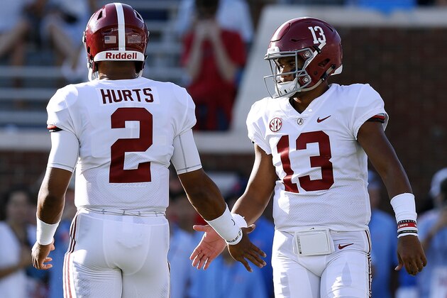OXFORD, MS - SEPTEMBER 15:  Tua Tagovailoa #13 of the Alabama Crimson Tide and Jalen Hurts #2 warms up before a game against the Mississippi Rebels at Vaught-Hemingway Stadium on September 15, 2018 in Oxford, Mississippi.  (Photo by Jonathan Bachman/Getty Images)