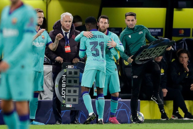 DORTMUND, GERMANY - SEPTEMBER 17: (L-R) Ansu Fati of FC Barcelona, Lionel Messi of FC Barcelona  during the UEFA Champions League  match between Borussia Dortmund v FC Barcelona at the Signal Iduna Park on September 17, 2019 in Dortmund Germany (Photo by Laurens Lindhout/Soccrates/Getty Images)