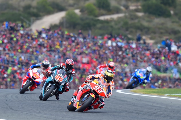Repsol Honda Team's Spanish rider Marc Marquez rides ahead Petronas Yamaha SRT's French rider Fabio Quartararo during the MotoGP race of the MotoGP Valencia Grand Prix at the Ricardo Tormo racetrack in Cheste near Valencia, on November 17, 2019. (Photo by JOSE JORDAN / AFP) (Photo by JOSE JORDAN/AFP via Getty Images)