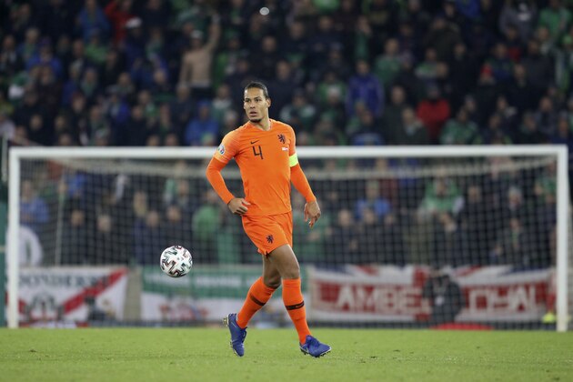 Netherlands' Virgil Van Dijk controls the ball during the Euro 2020 group C qualifying soccer match between Northern Ireland and the Netherlands at Windsor Park, Belfast, Northern Ireland, Saturday, Nov. 16, 2019. (AP Photo/Peter Morrison)