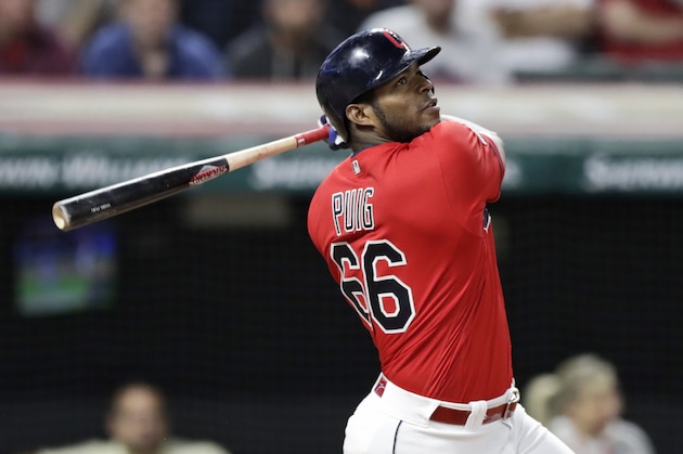 Cleveland Indians' Yasiel Puig watches his ball after hitting a game-winning RBI-single in the 10th inning in a baseball game against the Detroit Tigers, Wednesday, Sept. 18, 2019, in Cleveland. The Indians won 2-1 in ten innings. (AP Photo/Tony Dejak)