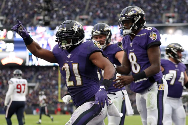 BALTIMORE, MARYLAND - NOVEMBER 17: Mark Ingram #21 of the Baltimore Ravens celebrates with Lamar Jackson #8 after scoring a fourth quarter touchdown against the Houston Texans at M&T Bank Stadium on November 17, 2019 in Baltimore, Maryland. (Photo by Rob Carr/Getty Images)