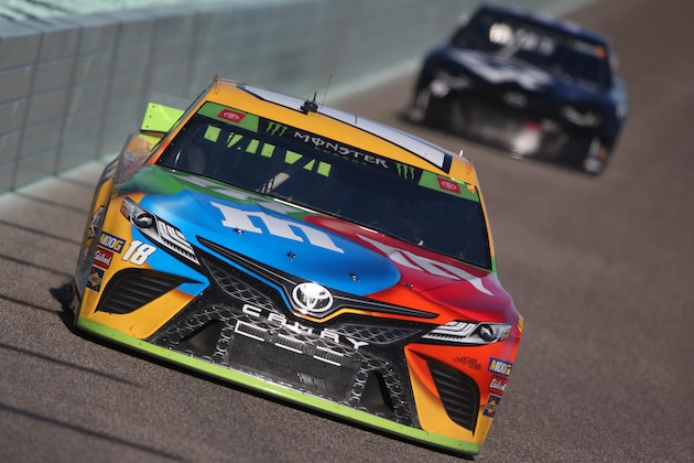 HOMESTEAD, FLORIDA - NOVEMBER 17: Kyle Busch, driver of the #18 M&M's Toyota, leads a pack of cars during the Monster Energy NASCAR Cup Series Ford EcoBoost 400 at Homestead Speedway on November 17, 2019 in Homestead, Florida. (Photo by Brian Lawdermilk/Getty Images)