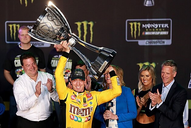 HOMESTEAD, FLORIDA - NOVEMBER 17: Kyle Busch, driver of the #18 M&M's Toyota, celebrates in victory lane after winning the Monster Energy NASCAR Cup Series Championship and the Monster Energy NASCAR Cup Series Ford EcoBoost 400 at Homestead Speedway on November 17, 2019 in Homestead, Florida. (Photo by Sean Gardner/Getty Images)