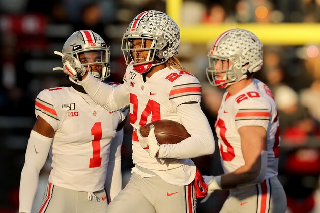 PISCATAWAY, NEW JERSEY - NOVEMBER 16:  Shaun Wade #24 of the Ohio State Buckeyes celebrates his interception with teammates Jeff Okudah #1 and Pete Werner #20 in the first quarter against the Rutgers Scarlet Knights at SHI Stadium on November 16, 2019 in Piscataway, New Jersey. (Photo by Elsa/Getty Images)