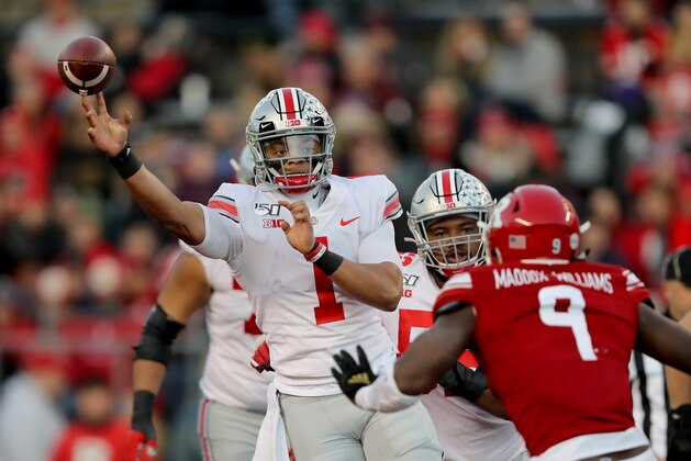 PISCATAWAY, NEW JERSEY - NOVEMBER 16:  Justin Fields #1 of the Ohio State Buckeyes passes the ball in the first quarter as Tyreek Maddox-Williams #9 of the Rutgers Scarlet Knights defends at SHI Stadium on November 16, 2019 in Piscataway, New Jersey. (Photo by Elsa/Getty Images)