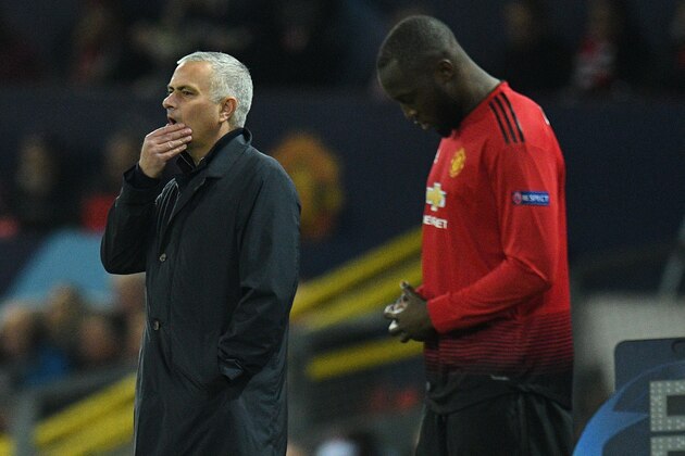 Manchester United's Portuguese manager Jose Mourinho (L) reacts as Manchester United's Belgian striker Romelu Lukaku waits to be substituted on during the UEFA Champions League group H football match between Manchester United and Young Boys at Old Trafford in Manchester, north-west England on November 27, 2018. (Photo by Oli SCARFF / AFP)        (Photo credit should read OLI SCARFF/AFP via Getty Images)