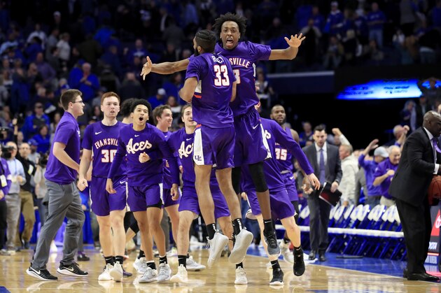 LEXINGTON, KENTUCKY - NOVEMBER 12:  Deandre Williams #13 and K.J. Riley #33 of the Evansville Aces celebrate in the 67-64 win over the Kentucky Wildcats at Rupp Arena on November 12, 2019 in Lexington, Kentucky. (Photo by Andy Lyons/Getty Images)